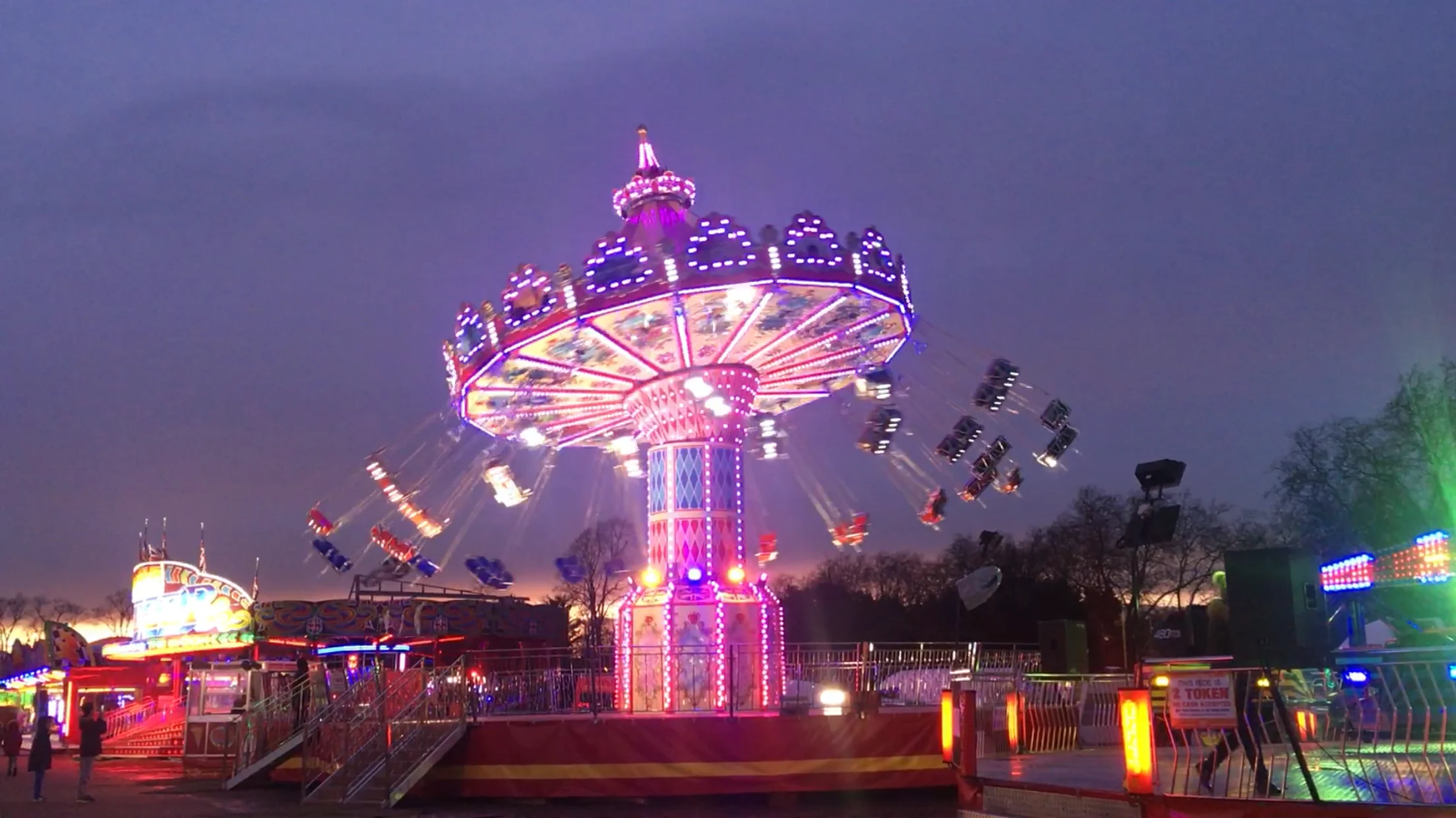 Wave swinger chair ride at dusk